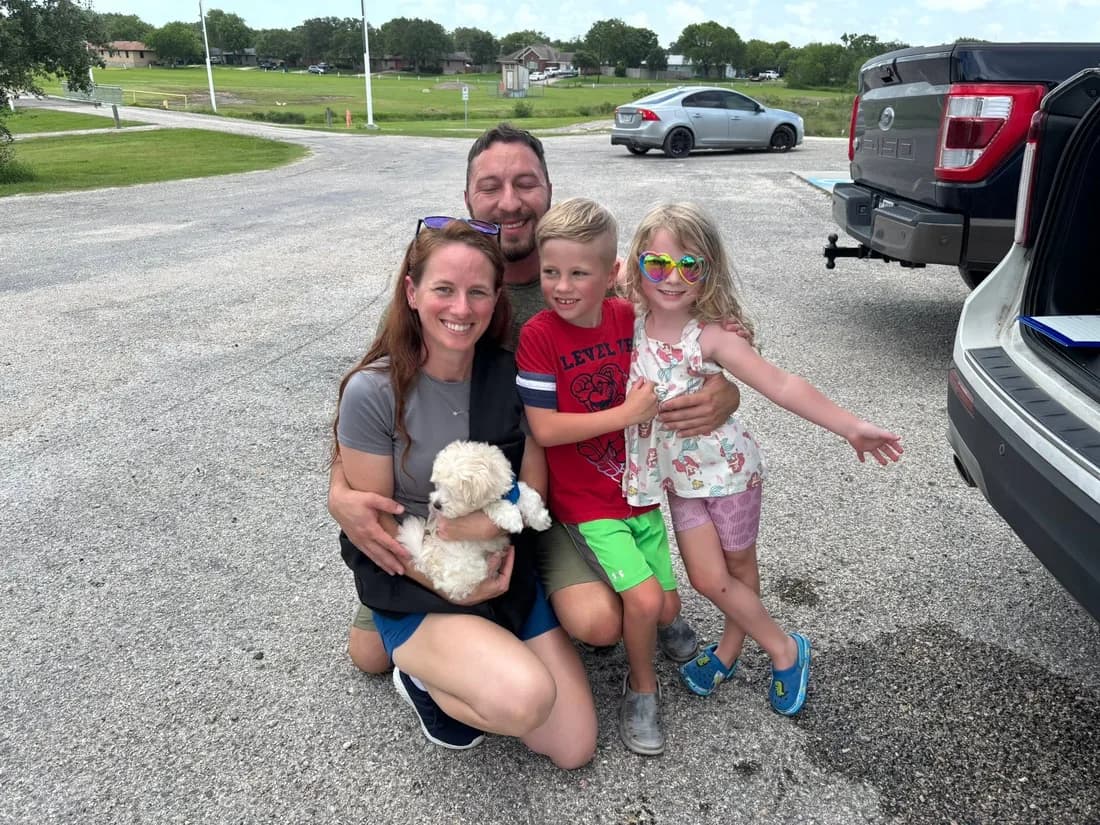 A family meeting their new puppy